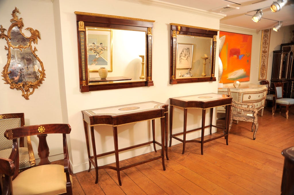 A Pair of Parcel Gilt Mahogany and Scagliola Consoles & Mirrors