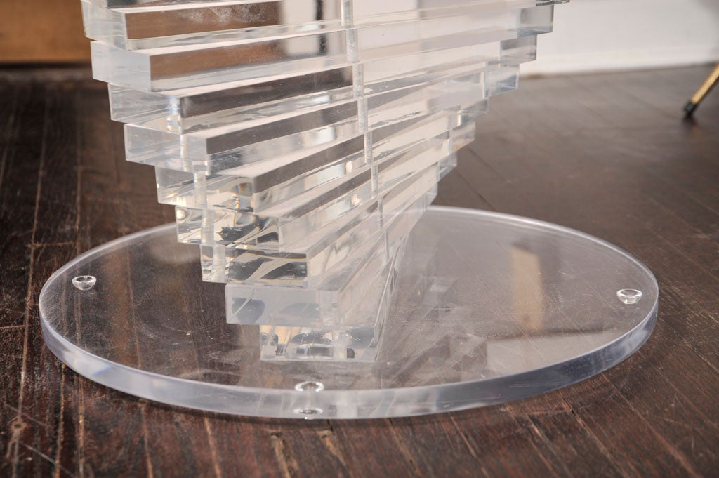 Spiral stacked lucite coffee table base with a circular lucite top