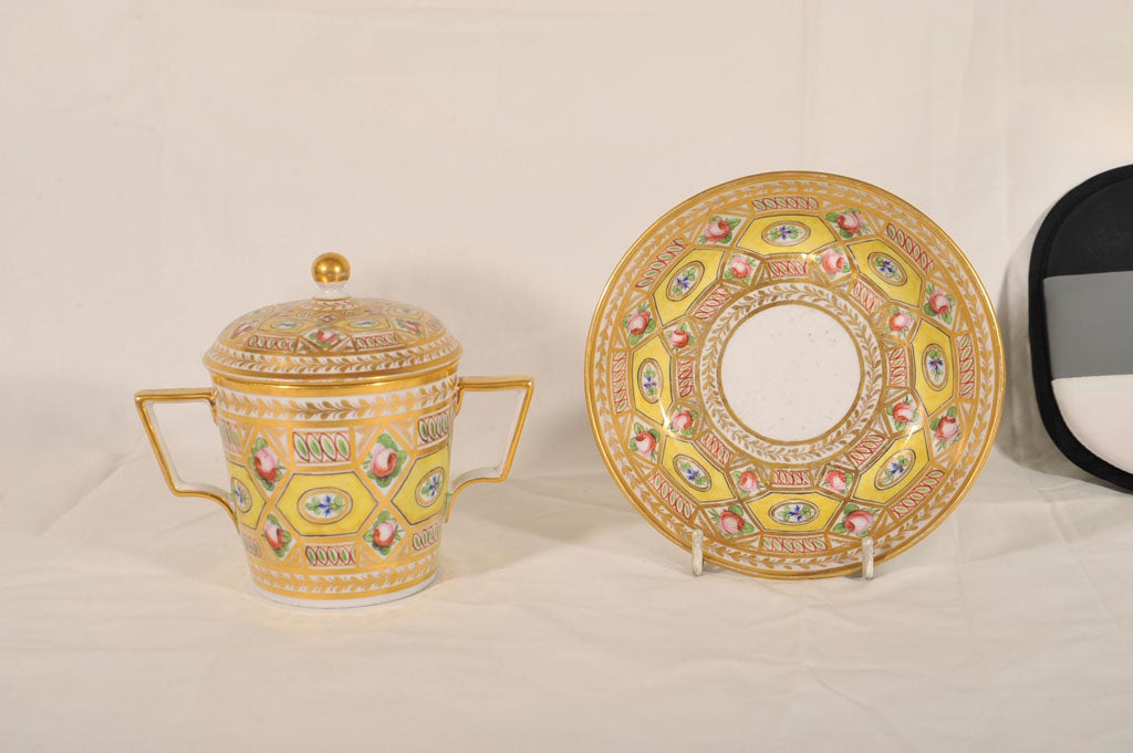 An early 19th century, Coalport covered chocolate cup and saucer in the remarkable Church Gresly pattern with yellow ground and exceptional gilding.