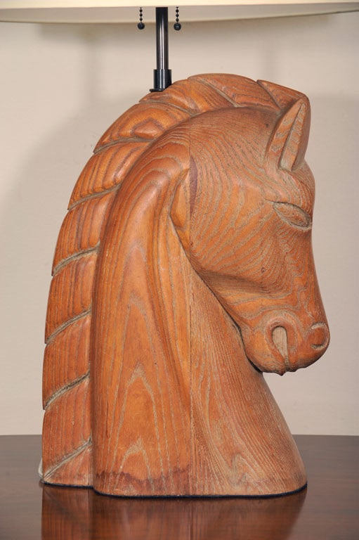 The body with an erect carved wooden head of a horse.