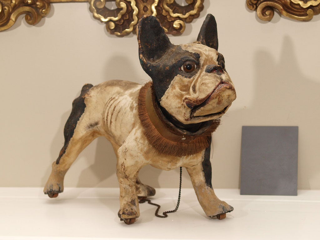 19th c French Papier Mache Bulldog with pull chain that makes him bark! has wheels to pull him by. This is an original 19th c. one not a 20's copy. It still barks and is in excellent condition. Expected wear on the paper mache.