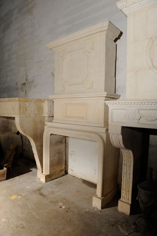 Impressive 17th. c. French limestone mantel/fireplace surround.
