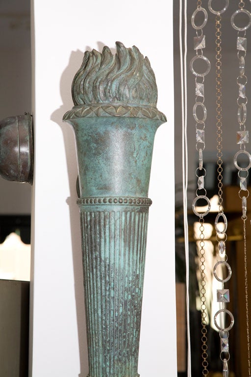 Pair of Cast Bronze Torch Sconces from Warner Estate In Excellent Condition In Palm Desert, CA