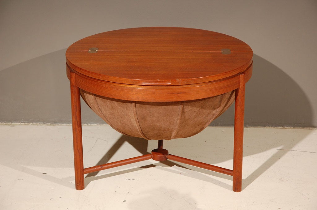 Unusual teak sewing or side table designed by Rastad & Relling and manufactured by Rasmus Solberg.  This piece took 1st prize at the 1962 Norwegian design competition!