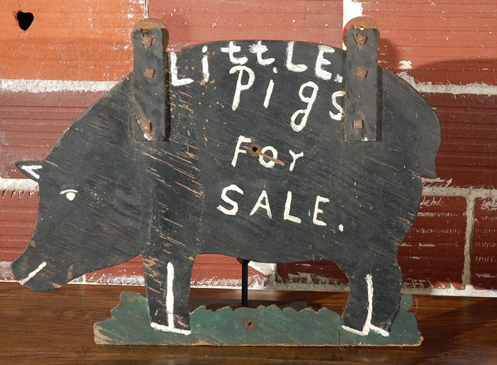 What a pig!  Appropriately shaped trade sign from a Midwestern pig farm.  Very cool wood strap and washer hangers attached to pig so it could be viewed from both sides.   Original paint surface.  Image and 