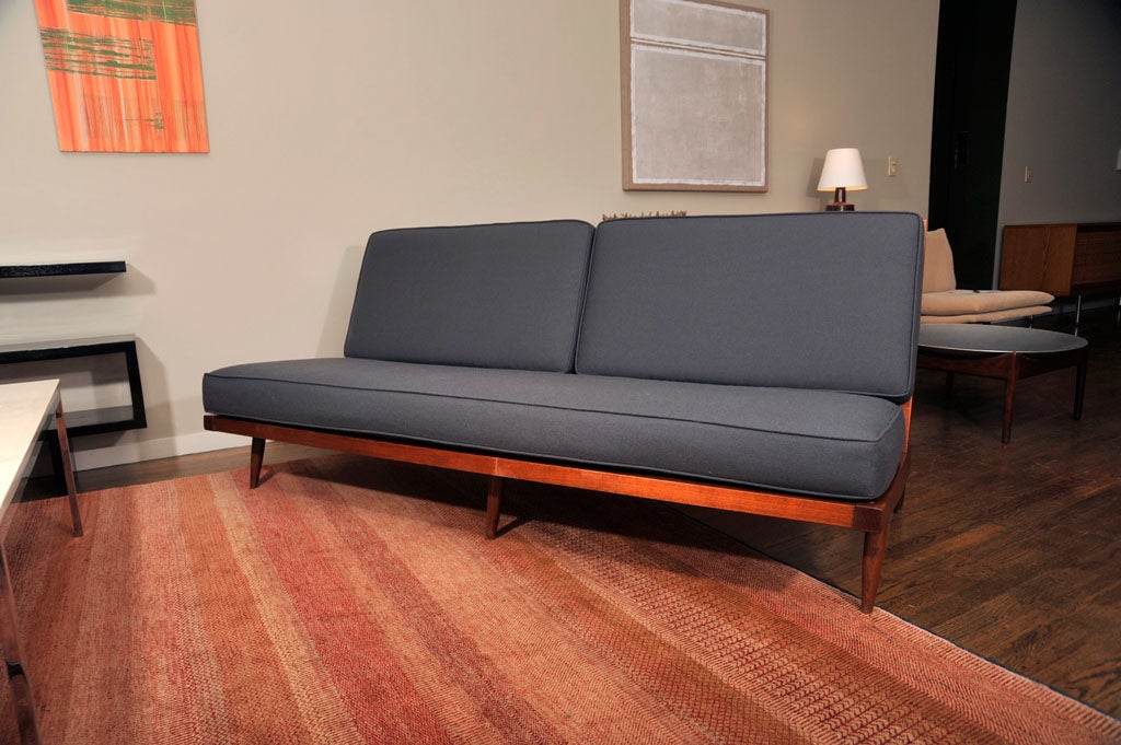 George Nakashima solid walnut sofa with slatted back and tapering legs.  Cushions have been reupholstered in Knoll wool.