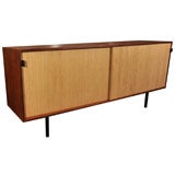 Florence Knoll teak and sliding door credenza on steel legs