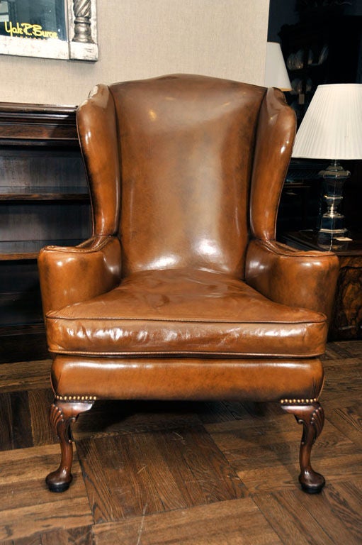 Pair of Queen Anne-Style Leathered Wing Chairs, England, Late 19th/Early 20th Century.<br />
<br />
31 inches wide x 42 inches high