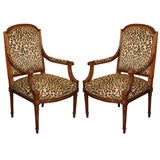 Pair Louis XVI Style Carved Fauteuils with Faux Upholstery