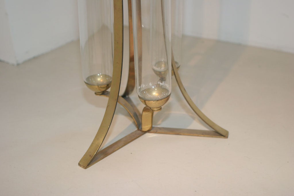 Gabriella Crespi

A large vase with three glass cylinders and brass base.

Measurement is approximate.