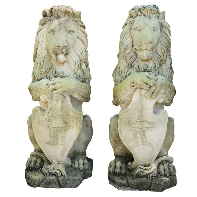 A Pair of Sitting Lions For Sale