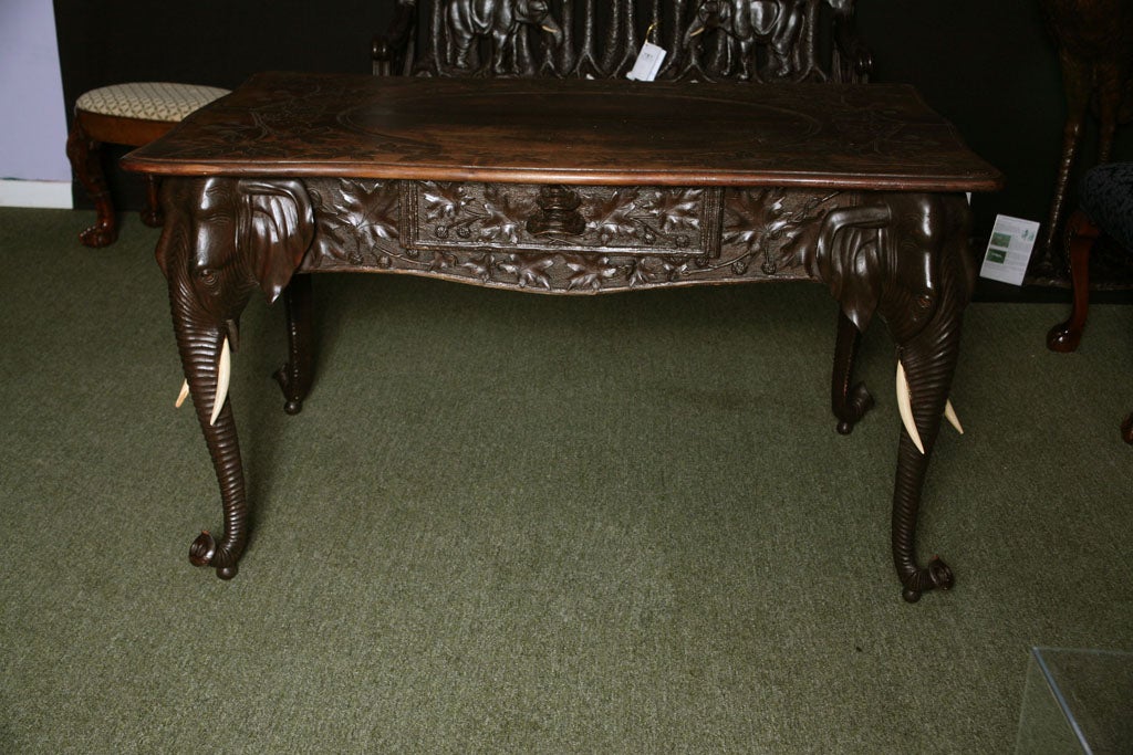 A 19th century Swiss Carved table with Elephant carvings