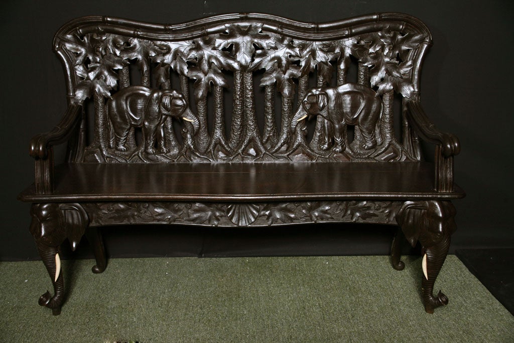 A 19th century Swiss Carved settee with Elephant carvings