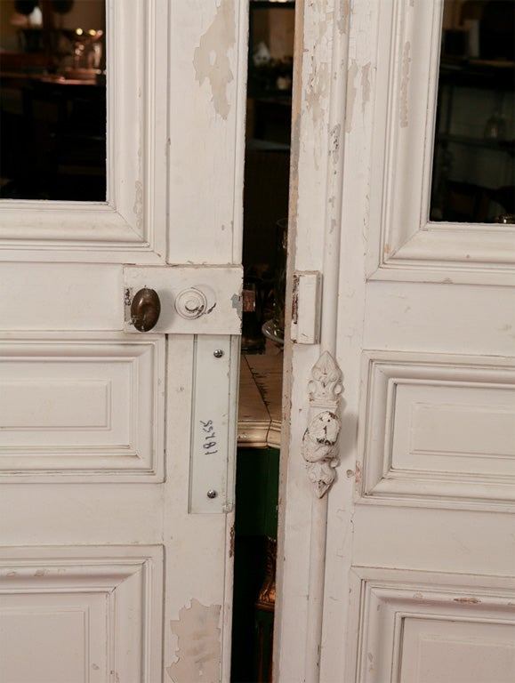 Pair of tall painted doors with original hardware.  Will need new glass.  Other doors available but not with glass panel.  Doors can work well in Swedish Gustavian style decor