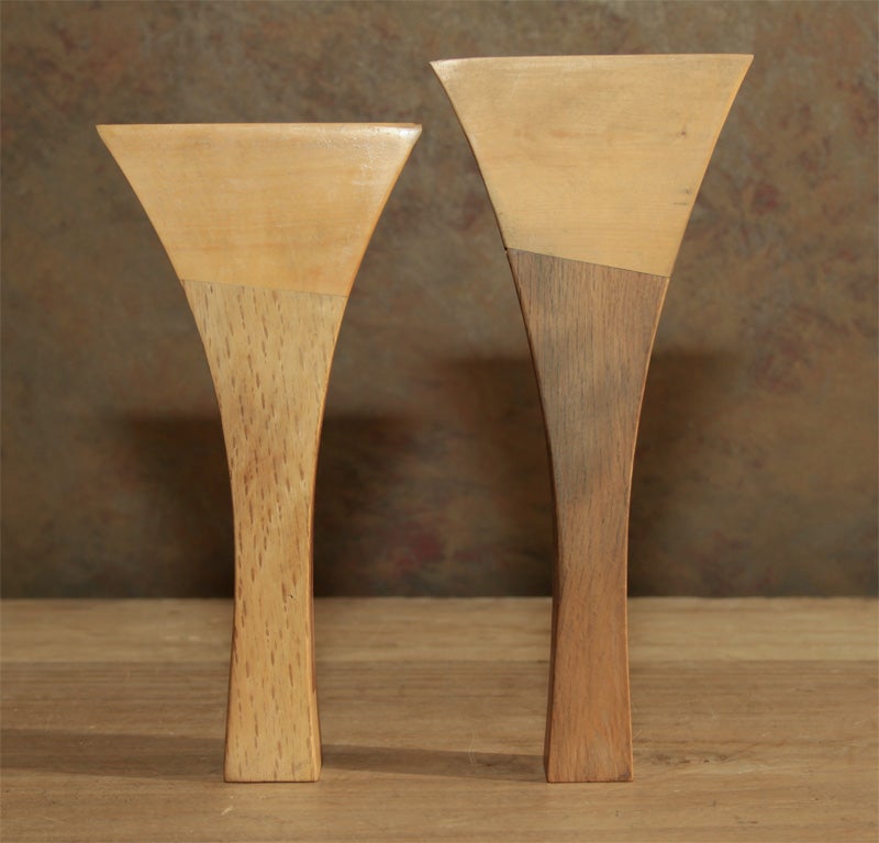 Japanese hardwood plectrum (bachi) for a shamisen.  The shamisen is a traditional three stringed instrument. The plectrum consisting of two different woods for the handle and the end.  The handle weighted with an inserted lead weight.<br />
Early