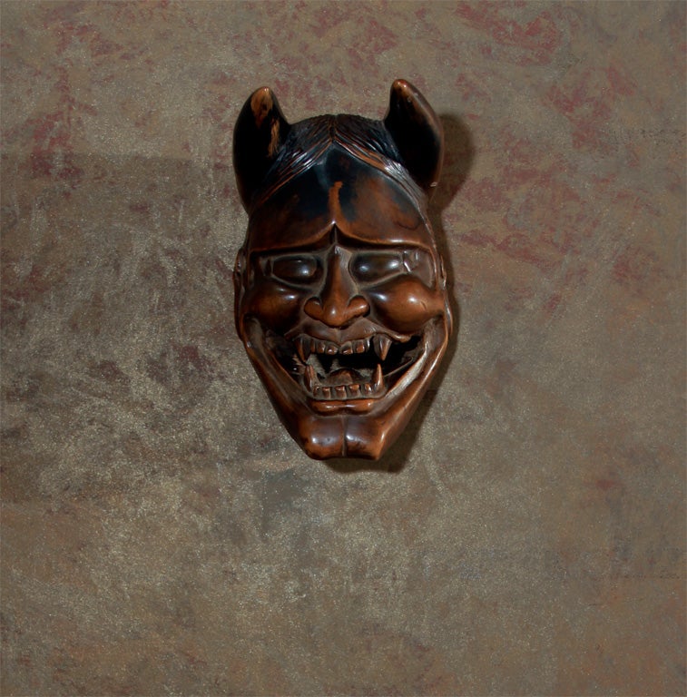 A Japanese carving of Hannya, a female demon that frequently occurred in traditional Noh plays. The Hannya represented the anger or jealousies of the female gender which was a popular subject folk plays as well. This example used as a temple