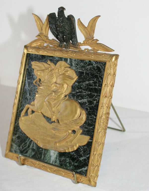 THE PLAQUE MOUNTED WITH A LOW RELIEF FIGURE OF NAPOLEON ON HORSE BACK INSCRIBED 