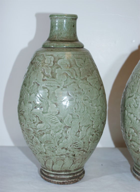A PAIR OF CELADON GLAZED STONEWARE VASES. CHINESE, 19th CENTURY
