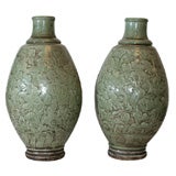 Antique A PAIR OF CELADON GLAZED STONEWARE VASES. CHINESE, 19th CENTURY