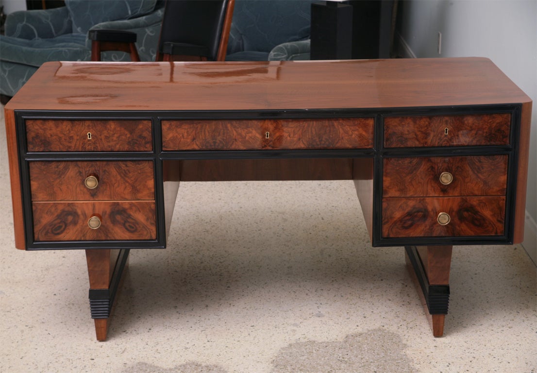 The rectangular walnut top above five burled walnut and ebonised drawrs, the back finished with rectangular burl walnut- provenance- collection of Ed Hardy.