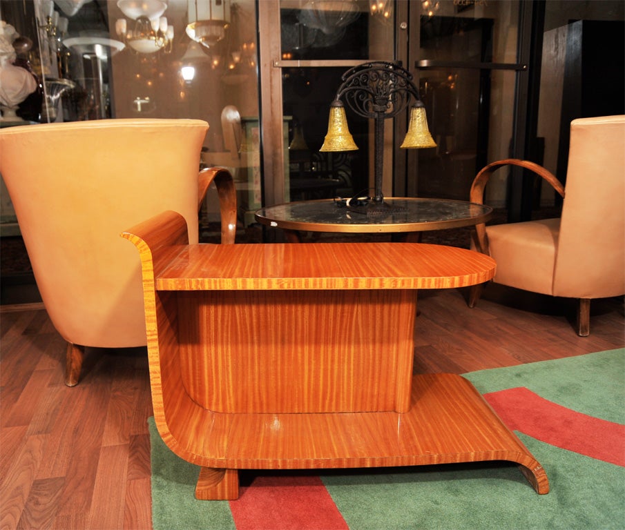 An unusual two-tier occasional table in satinwood from circa 1940.