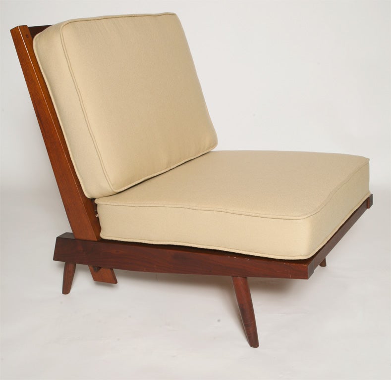 Great pair of Lounge chairs by George Nakashima.<br />
removable cushion,wood slat backs<br />
English Walnut and upholstery<br />
Price is for the pair