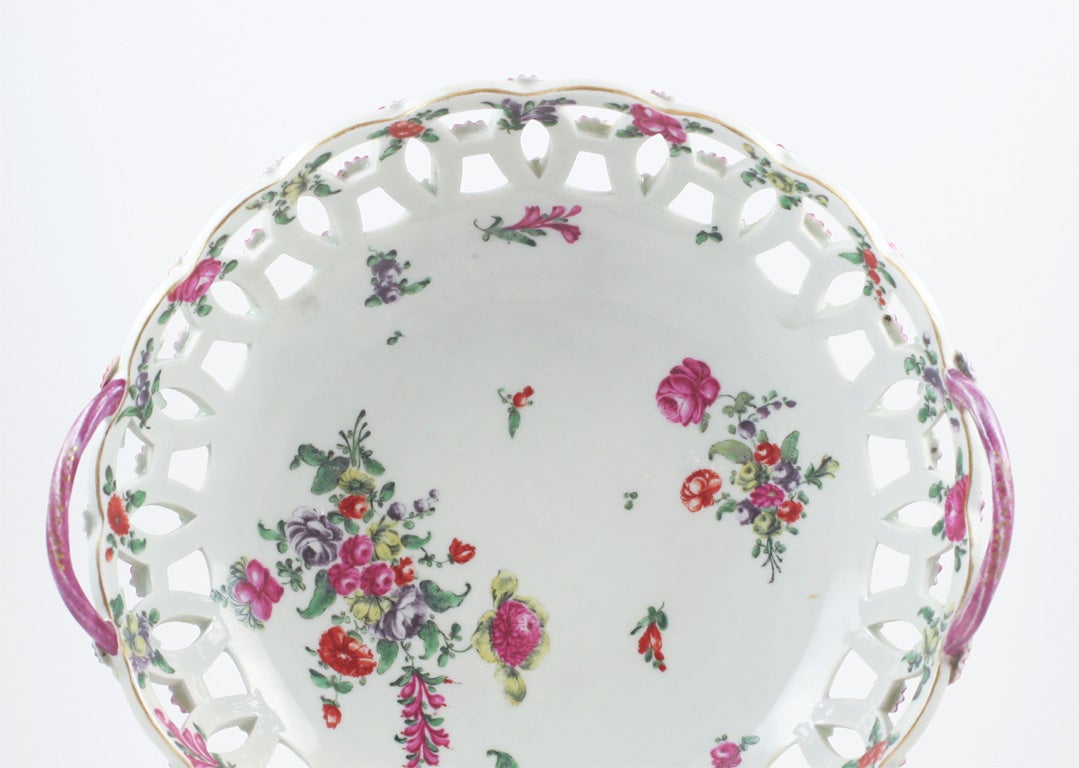 A rare and fine First Period Worcester porcelain yellow ground pierced basket painted with English flowers, the outside of basket yellow ground with raised puce florets
