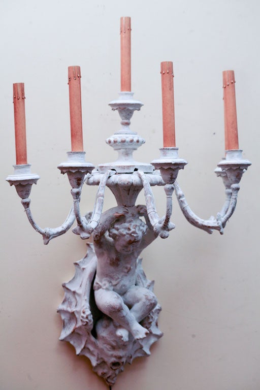 A PAIR OF PAPIER-MACHE' AND WOOD CHERUB SCONCES