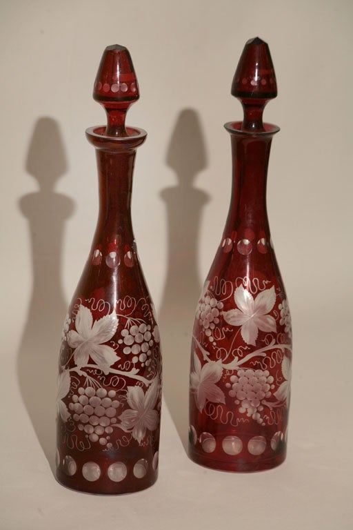 A matched pair of of Bohemian Ruby Flashed & Etched cut to clear glass Decanters. Originally priced $ 550.00 for the pair, now reduced to $350.00
