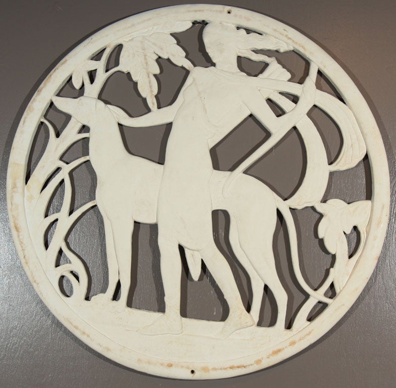A plaster on wood French Art Deco style wall plaque of Diana the Huntress.