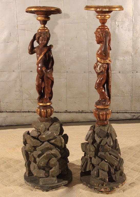 Pair Italian Torcheres With Carved Putti and Rock Bases