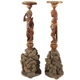 Pair Italian Torcheres With Carved Putti and Rock Bases