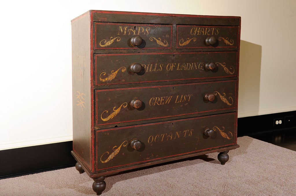 This fanciful copy of a ship captain's chest was hand-painted in the late 19th Century for the cottage furniture market.  2 over 3 drawers, turned feet, name of Capt. Jonathan Steele on side, and 