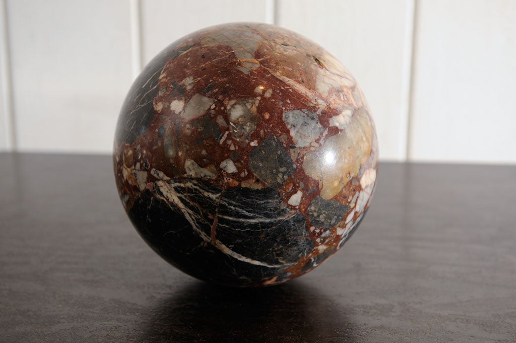 Large Italian hand carved specimen marble ball.  This exemplifies the best of specimen marble- lovely coloration and complex graining.  For scale reference, this is the same size as a standard bowling ball.  Great soft old patina.