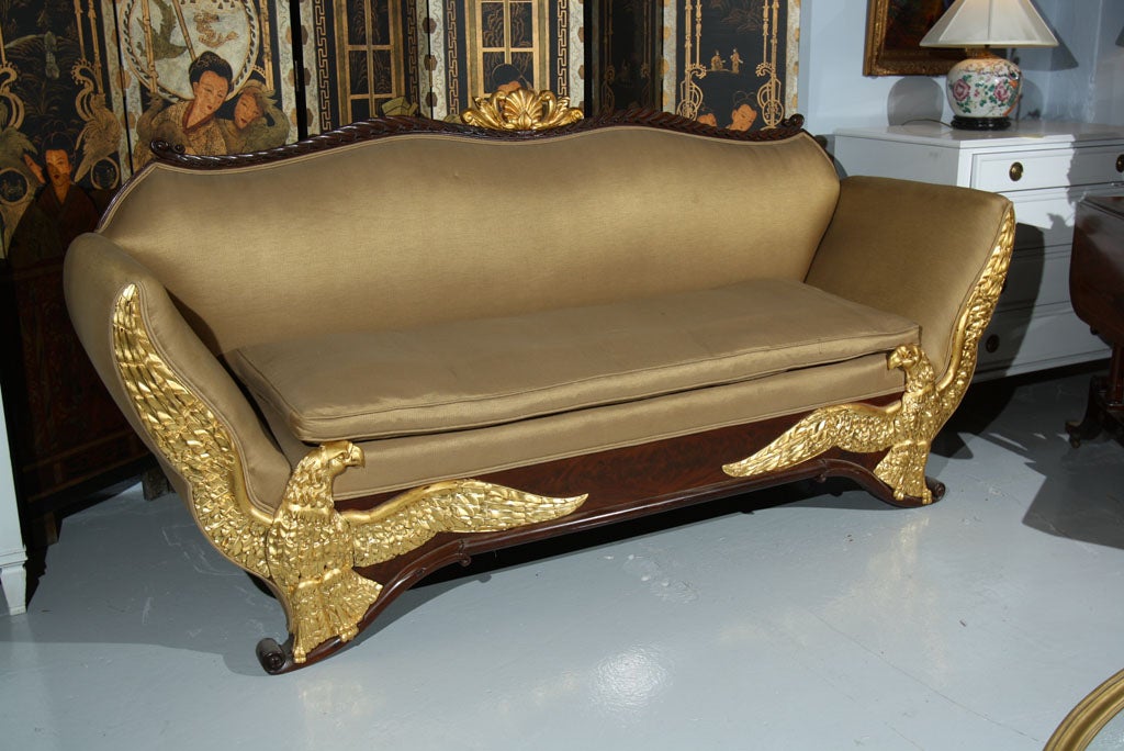 One of a kind Russian Neoclassical sofa. Each arm flanked with a finely detailed relief carved eagle. Compatable sofa having sold in Christies in NYC for $11,500. Please check internet for provenance.
