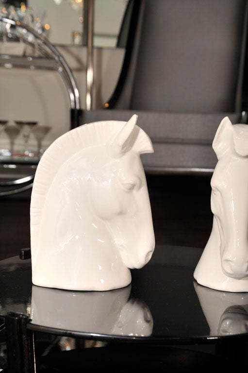 Beautiful pair of horse heads in white<br />
glaze ceramic.  Signed Daisa, which<br />
holds LLadro rights.  Stylized design,<br />
and can be sold separately as well <br />
for $475 each.