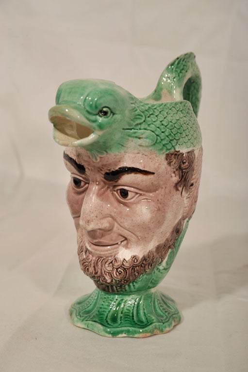 18th Century and Earlier An 18th Century Creamware Dolphin Head Mask Jug