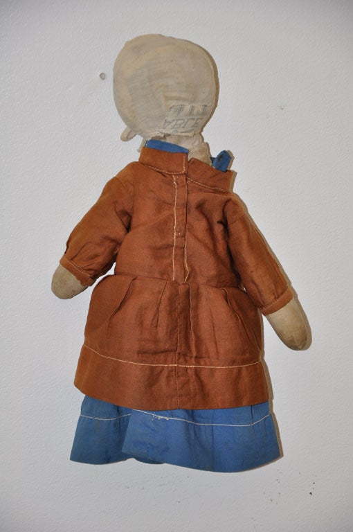 RARE AND VERY UNUSUAL AMISH  CHURCH DOLL FROM KALONA ,IOWA  .THIS DOLL HAS THE ORIGINAL BONNET MADE FROM A SALT SACK.THE BLUE DRESS IS MADE OF COTTON AND THE TAN TOP DRESS IS MADE OF POLISHED COTTON.THE DOLL HAS WOOL SOCKS .THE BODY IS ALL PIECED