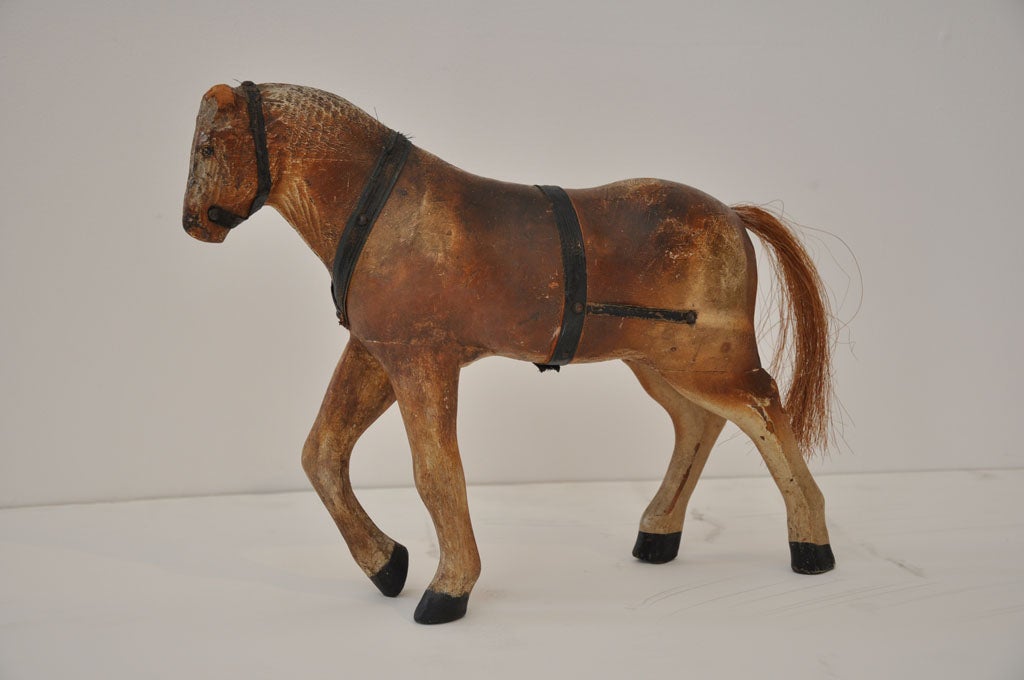 FOLKY AND HAND CARVED PINE AMISH CHILDS TOY HORSE FROM THE MID WEST. GOOD CONDITION AND PIECED LEGS AND HORSE HAIR TAIL.