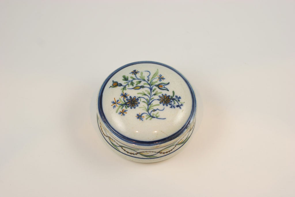 A rare English pearlware pottery erotic patchbox decorated in underglaze Pratt colors
