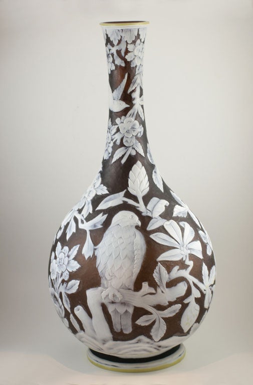 An important Thomas Webb & Sons three color cameo glass vase carved with birds, flowers leaves and branches