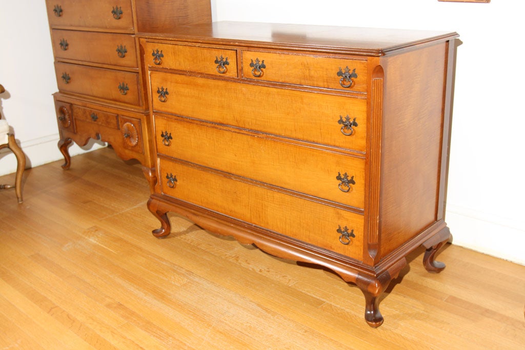 Five drawer Tiger Maple dresser.  The drawers are deep and ample.   The interior is in excellent shape.   Original brass pulls.  Strong construction.