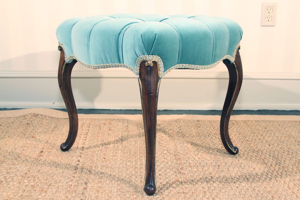 Charming late 19th century parcel gilt and Italian walnut stool with cabriolet legs and tufted upholstered seat.