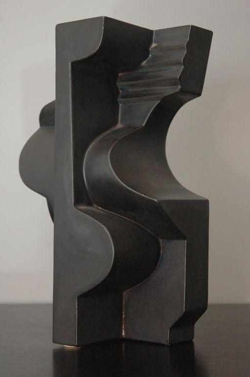 A ceramic sculpture glazed in black gun metal. Marked Nino Caruso 1974 54/200