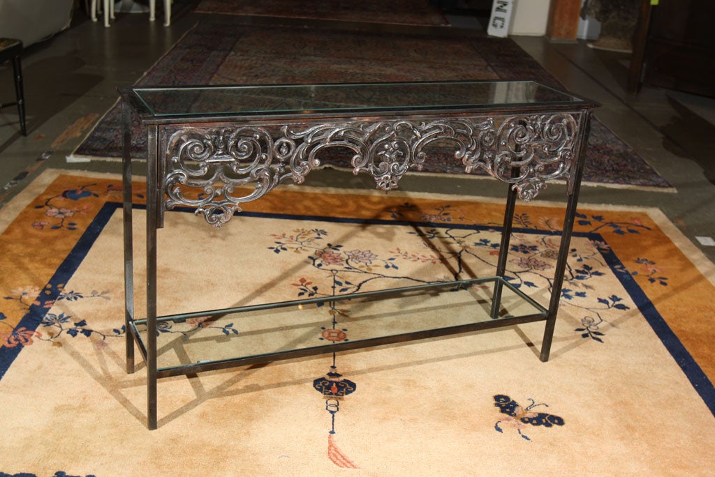 Offered here is a circa 1830 iron balcony architectural fragment from Paris made into a glass naroow console or sofa table.