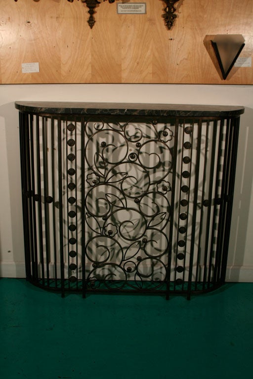 A Fer Forge console table with original marble. Stamped 'E. Brandt.'