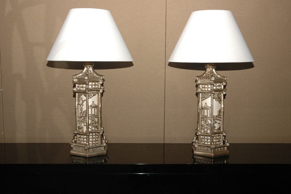 PAIR OF SILVER LEAFED CARVED ORIENTAL LAMPS