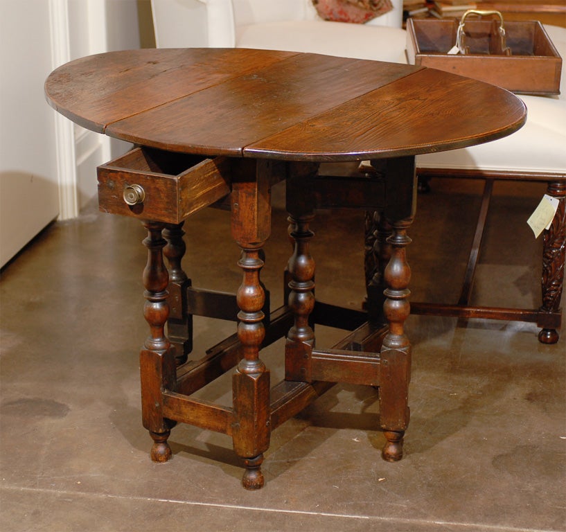 18 th.c English gateleg table with nice patina.Leaves are 14