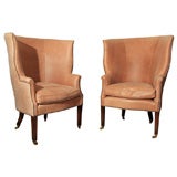 Pair of leather wing back chairs