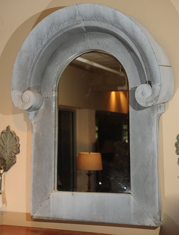Very Large-Scale Zinc Architectural Element as a Mirror Frame
